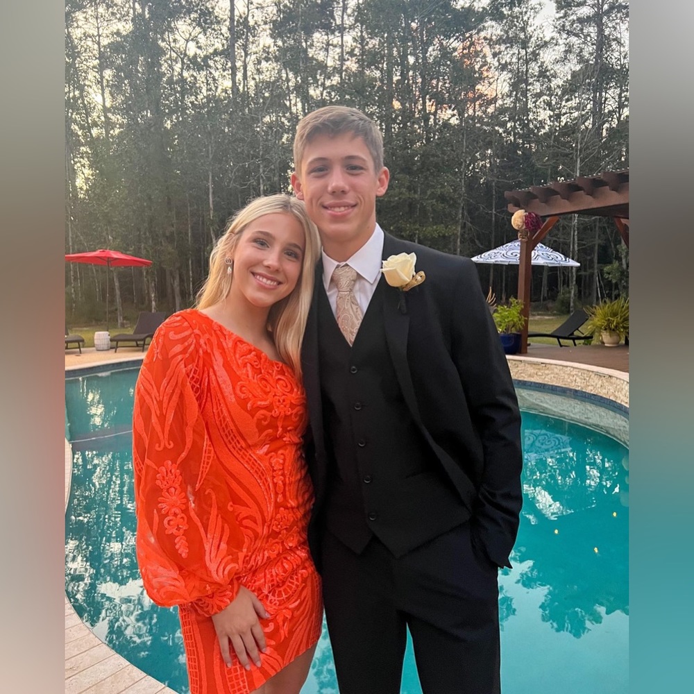 One shoulder orange sequin pattern homecoming dress. Size 2. From Berlinnova